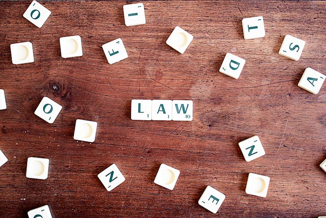 the word law spelled in Scrabble tiles